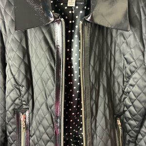 Caché quilted jacket , with shiny black leather appliqué and Polka Dot lining .